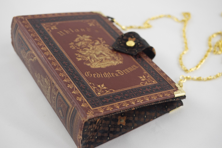 Clutch aus dem Buch "Uhland's Gedichte und Dramen"
