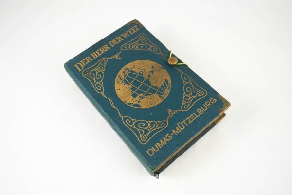 Schatulle aus einem Buch "Der Herr der Welt" petrolfarben, Goldaufschrift mit Globus, goldene Papierinnenausführung