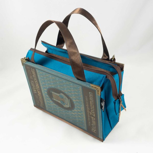 Tasche aus einem Buch "Poetischer Hausschatz" in Petroleum mit einer Harfe am Cover, kombiniert mit petrolfarbenen und braunen Stoffen