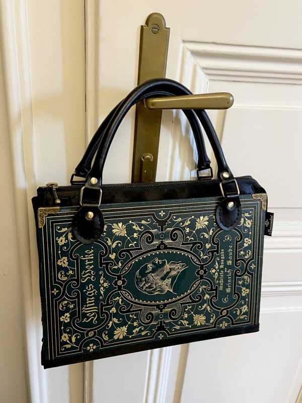 Tasche aus einem Prachteinband eines Lessing's Werke Buch in dunkelgrün/dunkelpetrol mit vielen goldenen und schwarzen Ornamenten und Prägungen kombiniert mit schwarzem Satinstoff